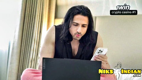 Niks Indian smirking with phone and laptop in tank top, hijabi stepbro scene