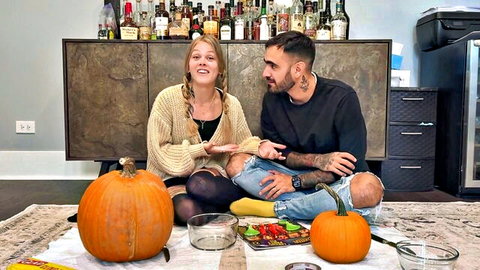 Sammm Next Door blonde in braids with tattooed partner, Halloween couple setup with pumpkins