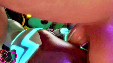 Neon-lit Midna cosplay close-up of curvy hips and ass in fantasy glow