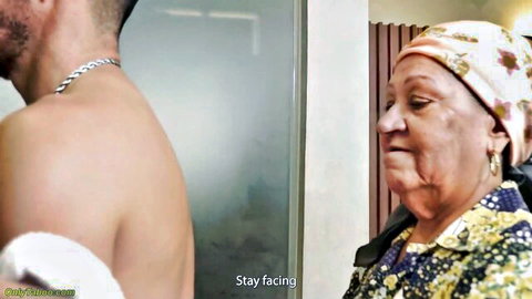 72-year-old BBW mom in headscarf facing shirtless man in steamy shower