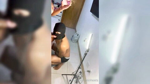 Amateur masked man in underwear squatting near woman in casual top