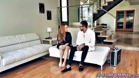 Busty redhead Summer Hart in blazer with black man on couch