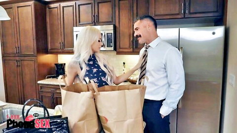 Romi Rain in sultry kitchen chat with suited man, holding bags