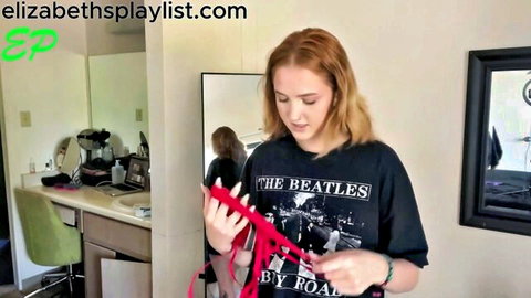 Redhead babe in Beatles tee tries red lingerie in hot seduction haul