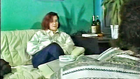 Vintage 1994 brunette sitting casually on couch in Strassenflirts 1 uncensored flick
