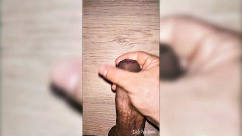 Close-up amateur jerk off of thick black cock on wooden surface