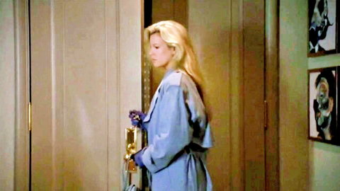 Kim Basinger as blonde in blue dress and gloves, doorway scene