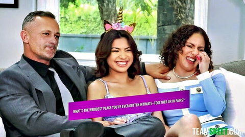 Smiling brunette teen and curly-haired Latina laugh with suited man discussing weirdest intimate sex places