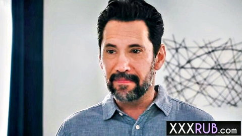 Handsome bearded man in blue shirt from Summer Vixen adult video, intense gaze