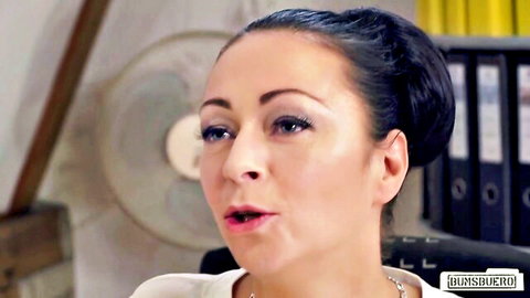 Mature brunette secretary with open mouth in office teasing blowjob