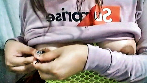 Amateur girl exposing small puffy nipples and tits pulling up purple hoodie
