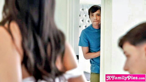 Brunette babe in low-cut white top eyes stepbrothers in mirror reflection teasing family fuck