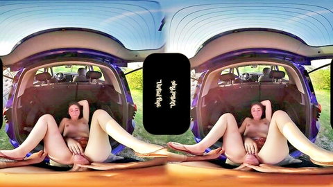 Petite brunette teen spreads legs fingering wet pussy on old man's cock in open car trunk VR POV