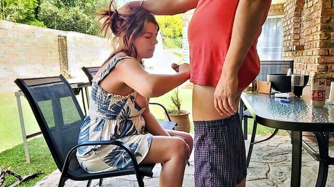 Neighbor's wife giving outdoor blowjob to man in shorts