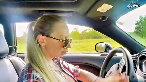 Blonde MILF driving car, teasing cleavage in open plaid shirt sunglasses