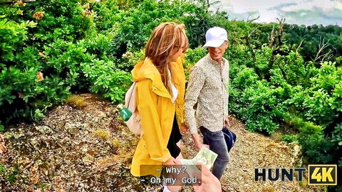 Ebony woman in yellow raincoat outdoors with cash-waving man - Hunt4K