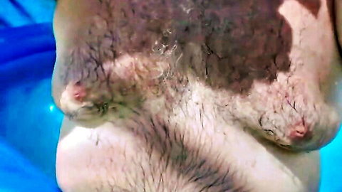 Hairy naked dad by pool showing chest and nipples