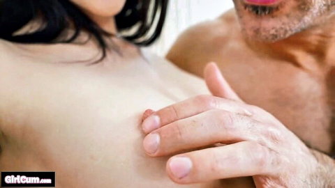 Asian woman topless as man gropes her perky breasts in intimate close-up