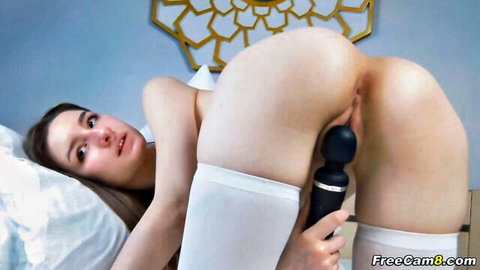 Sweet teen babe masturbates with vibrator in white stockings