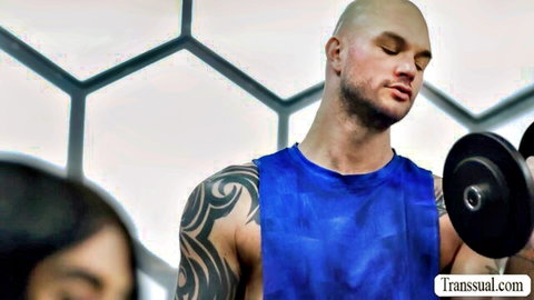 Cliff Jensen muscular tattooed hunk lifting weights in gym, blue tank top tease