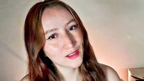 Vanlet redhead Asian camgirl close-up, seductive lips and bare shoulders