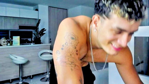 Noha Miler shirtless smiling Turkish male with arm tattoos and earring