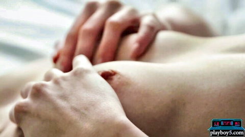 Asian MILF's nude breasts grabbed sensually in hot shower fun