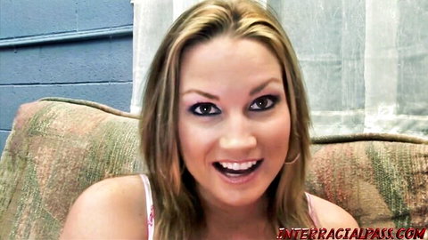 Smiling blonde woman in white tank top, interracial porn preview