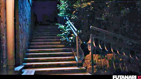Dark dimly lit stone staircase with railings greenery and lantern at night in futanari video