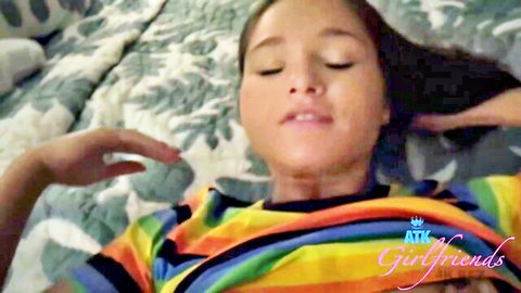 Siren lying on bed in rainbow shirt, eyes closed POV tease from ATK Girlfriends