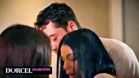 Two brunettes passionately kissing curly-haired stud in hot threesome close-up