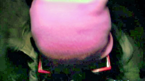Amateur close-up rear view of girl wearing fuzzy pink beanie hat outdoors