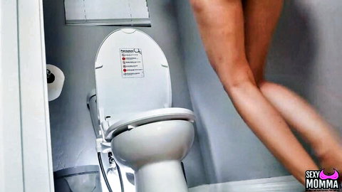 Sweet Sophia naked squatting over toilet in seductive bathroom pose