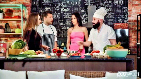 Brunette in pink dress with chefs in kitchen for sloppy blowjob