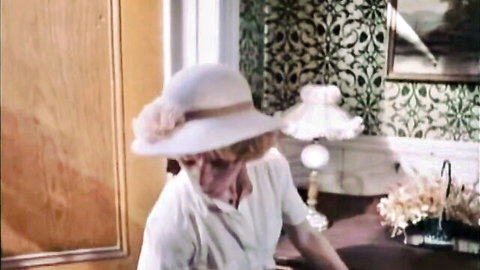 Vintage 1979 blonde mature woman in white hat and dress