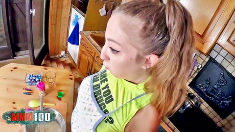 Petite blonde in sexy apron during steamy kitchen pastry lesson
