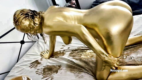 Golden painted teen in messy amateur sensual doggy pose on bed