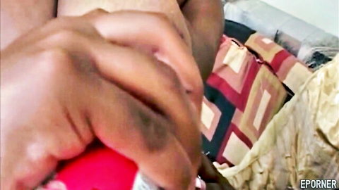 Ebony BBW lesbians gripping red toy in passionate bedroom play
