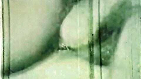 Blurry close-up of curvy woman's large breast in Climax Original Lusty Au Pair classic porn