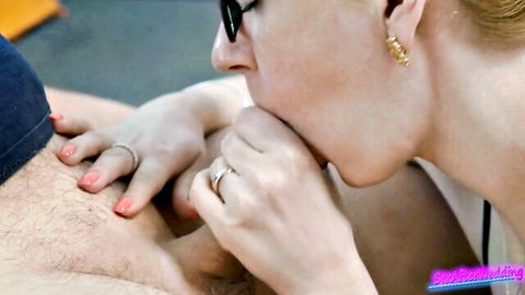 Blonde MILF in glasses grips hairy cock with ringed hands lips teasing tip for blowjob