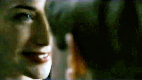 Seductive smiling MILF closeup with plump red lips and sultry gaze