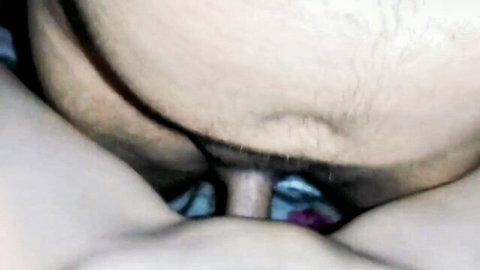 Amateur close-up of Asian couple's vaginal penetration, hairy pubes visible