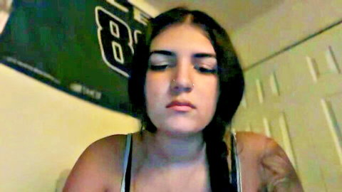 Goddess Madii BBW camgirl with dark braided hair and sultry gaze