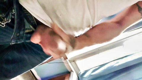 Muscular tattooed arm pulls white towel teasing nude girl's pale ass by window