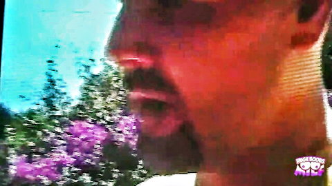 Close-up of hung guy outdoors by pool, ready to cum on hot girl's glasses