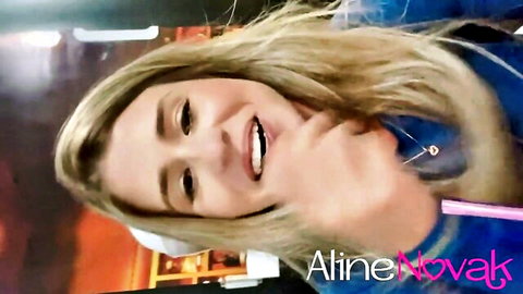 Blonde Aline Novak smiles with mouth open in seductive closeup tease