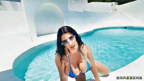 Sarah Arabic in wet blue bikini by pool, busty Arab beauty posing seductively