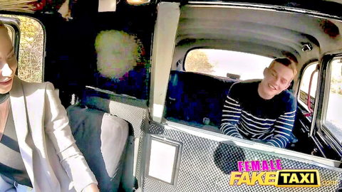 Blonde babe in blazer smiles seductively at young guy in Fake Taxi cab
