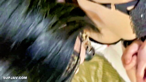 Close-up of busty Asian woman in black lace lingerie, man touching her cleavage