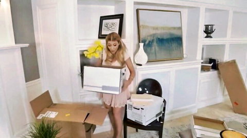 Kayla Kayden in short pink dress holding box in sexy neighbor scene